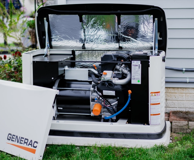 PROTECT YOUR HOME Open Generac whole-house backup generator installed beside a residential home for outage protection.